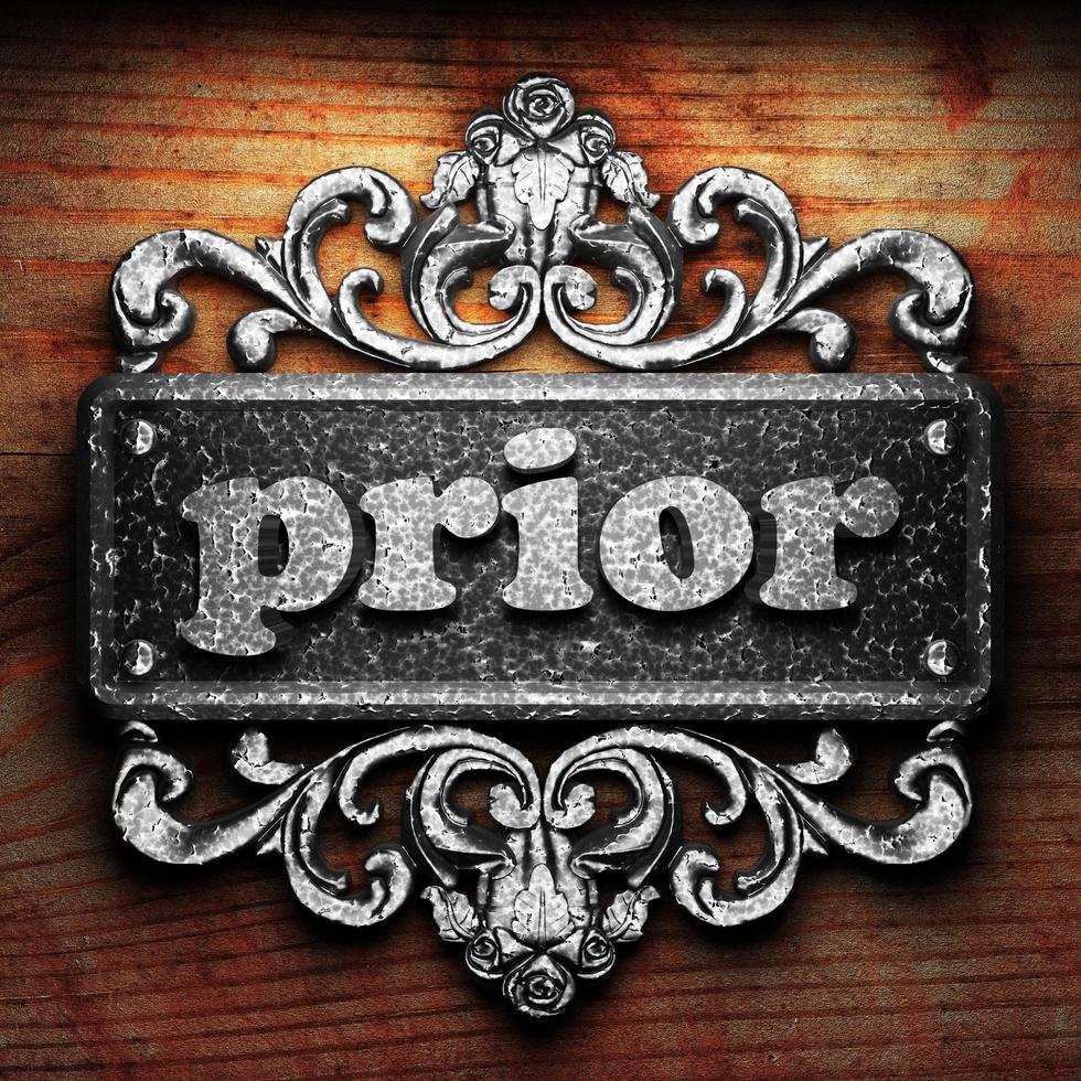 prior word of iron on wooden background photo