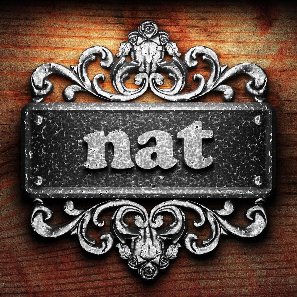 nat word of iron on wooden background photo