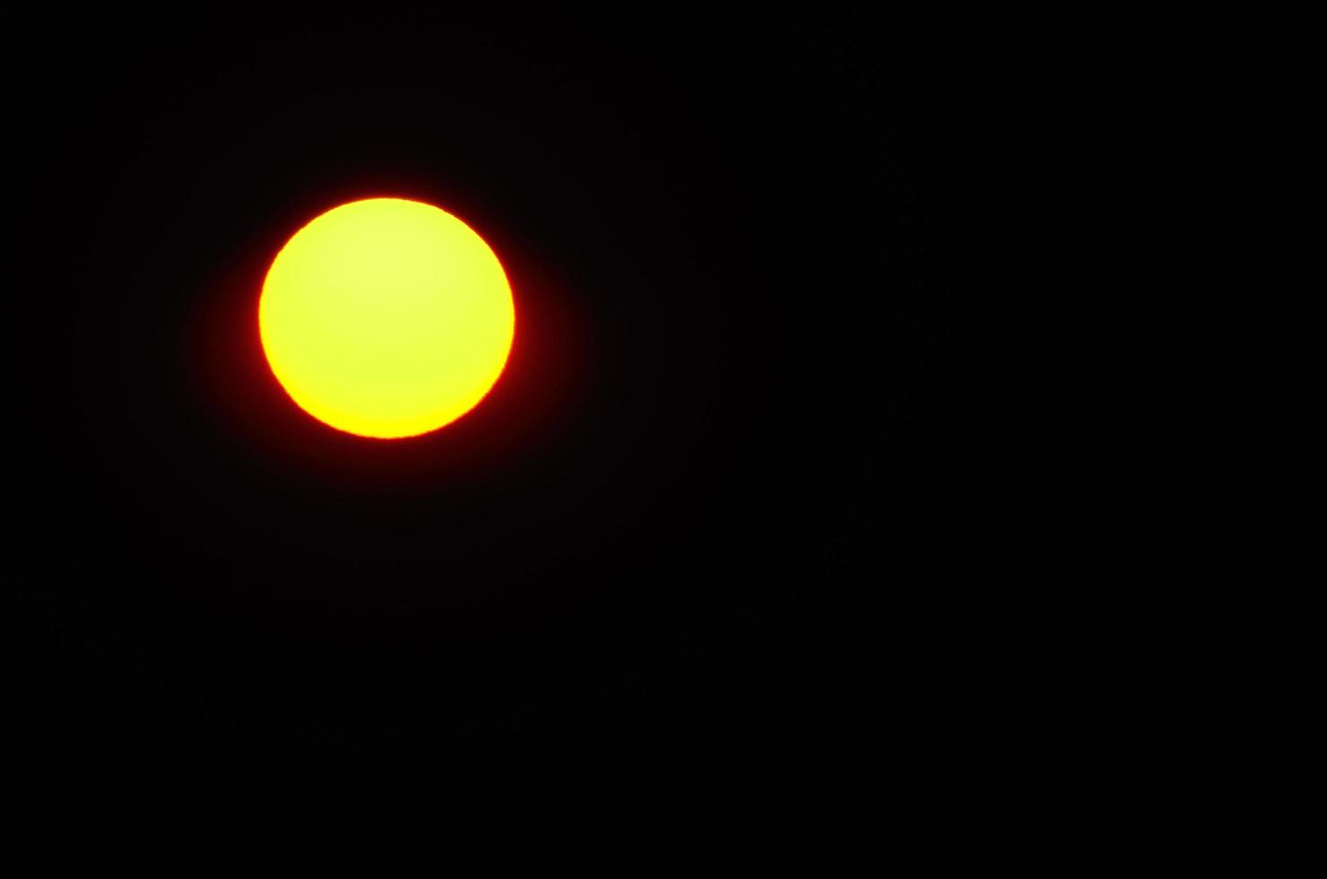 shining sun and black sky photo