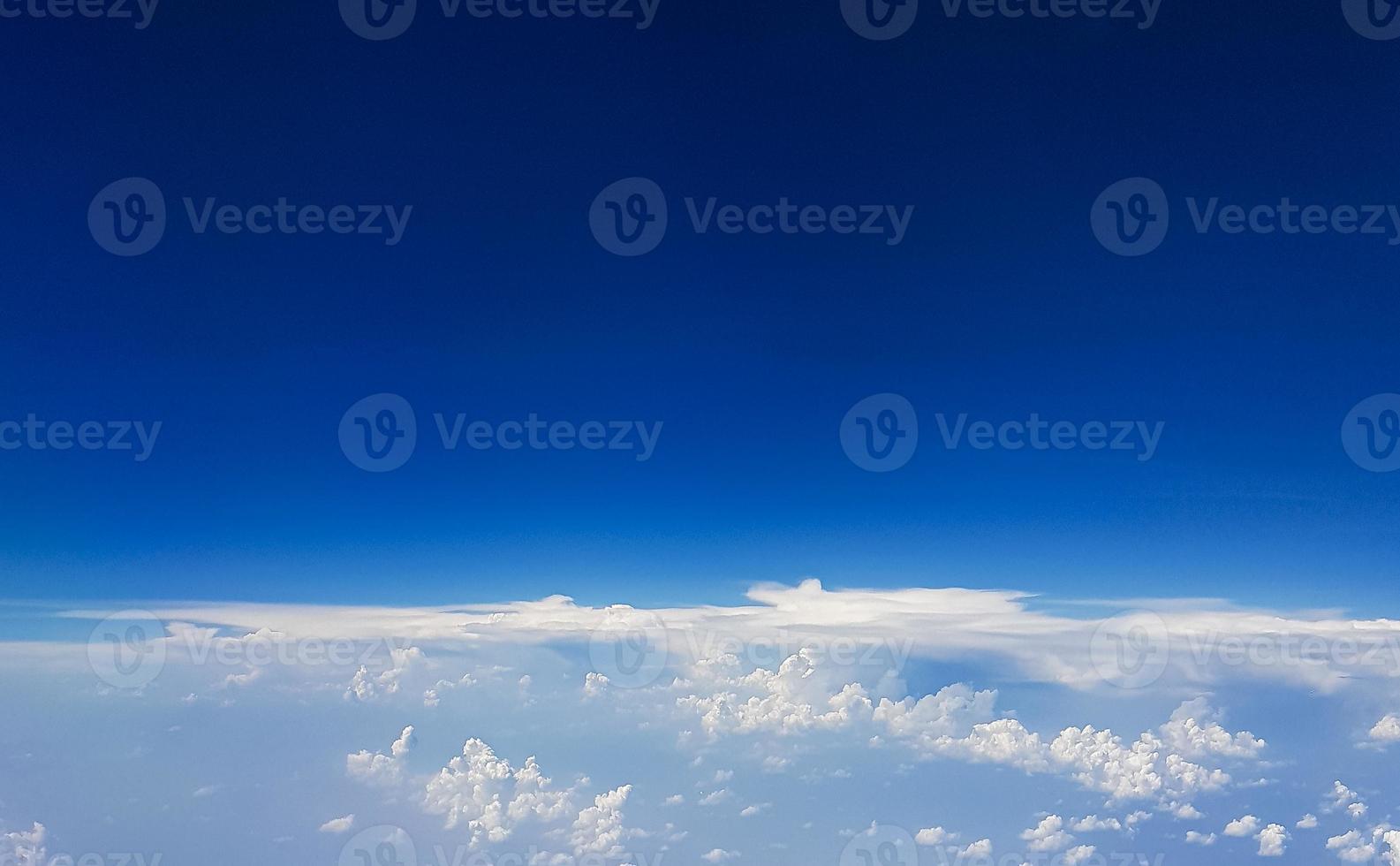 Flying above the clouds over the countryside of Thailand. photo