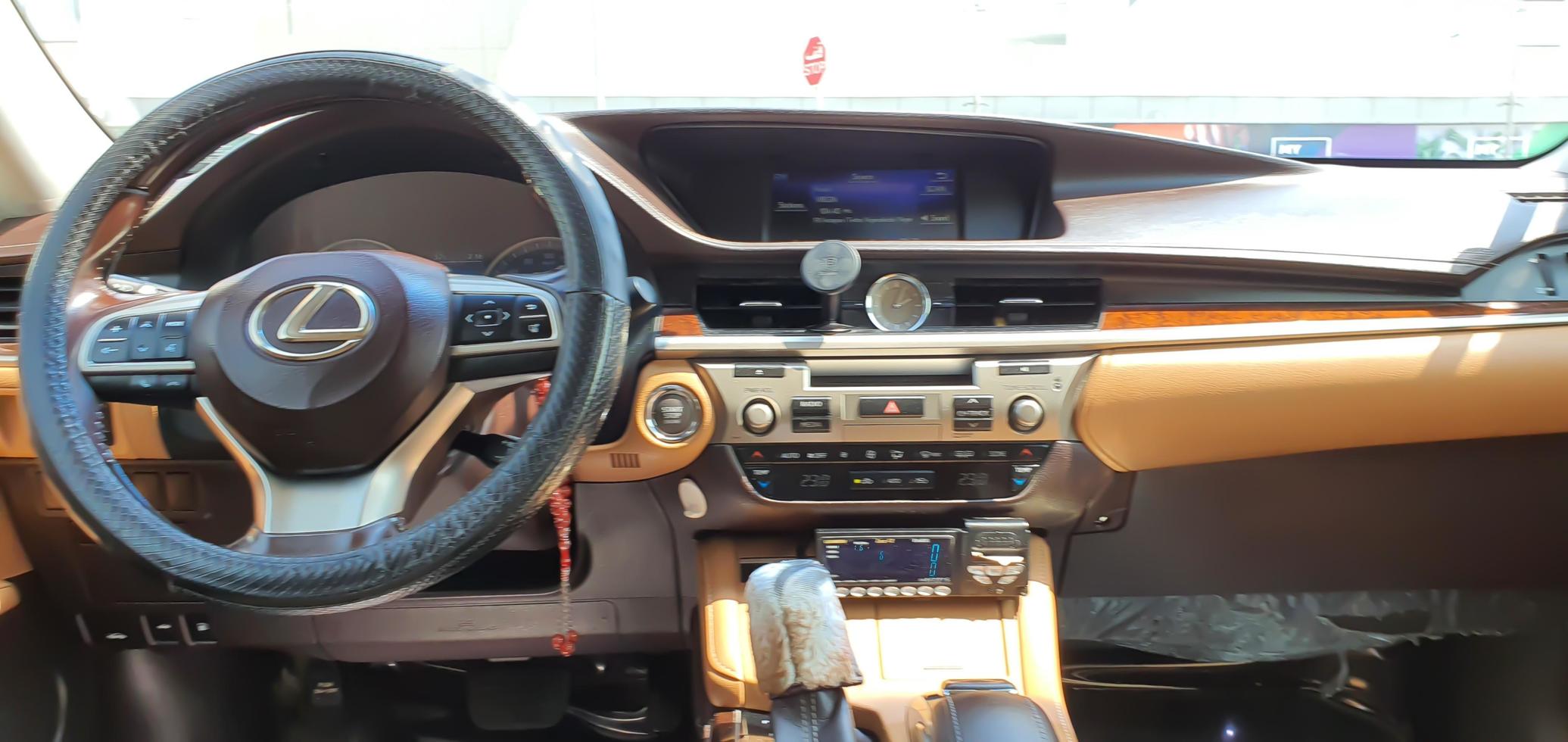 Lexus RX-350, steering wheel, shift lever, multimedia systems, speedometer, tachometer with dashboard and Lexus logo photo