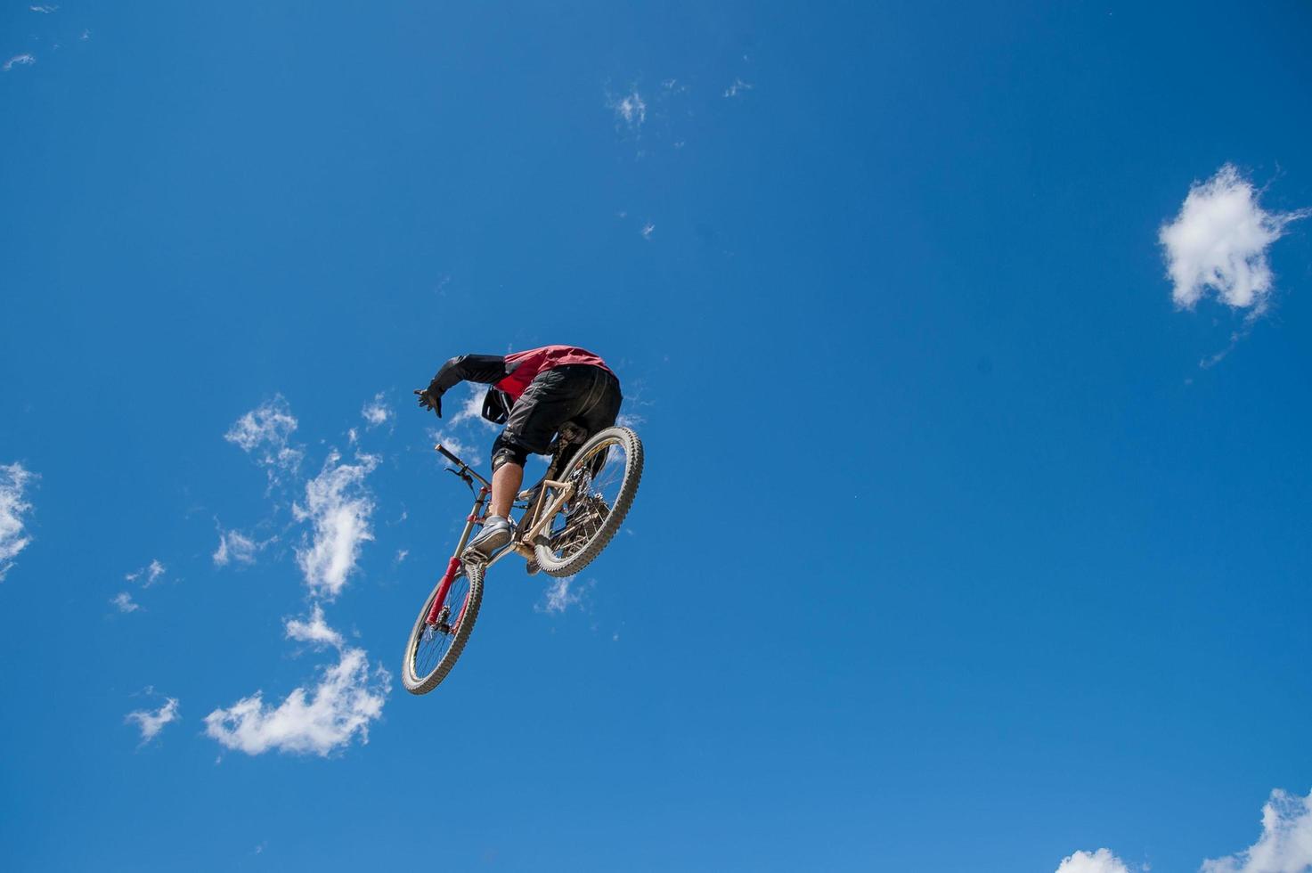 Liivigno Italy 2014 Boy who finishes the descent by bike with a jump photo