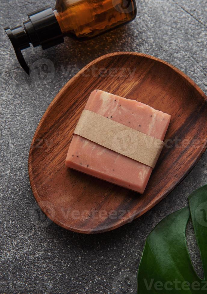 Handmade soap bar and green leaf photo