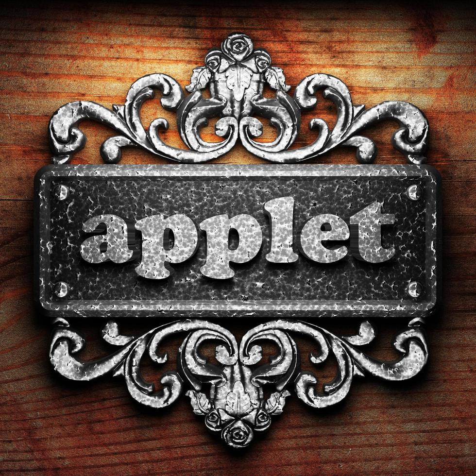 applet word of iron on wooden background photo