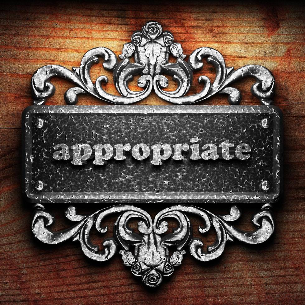 appropriate word of iron on wooden background photo