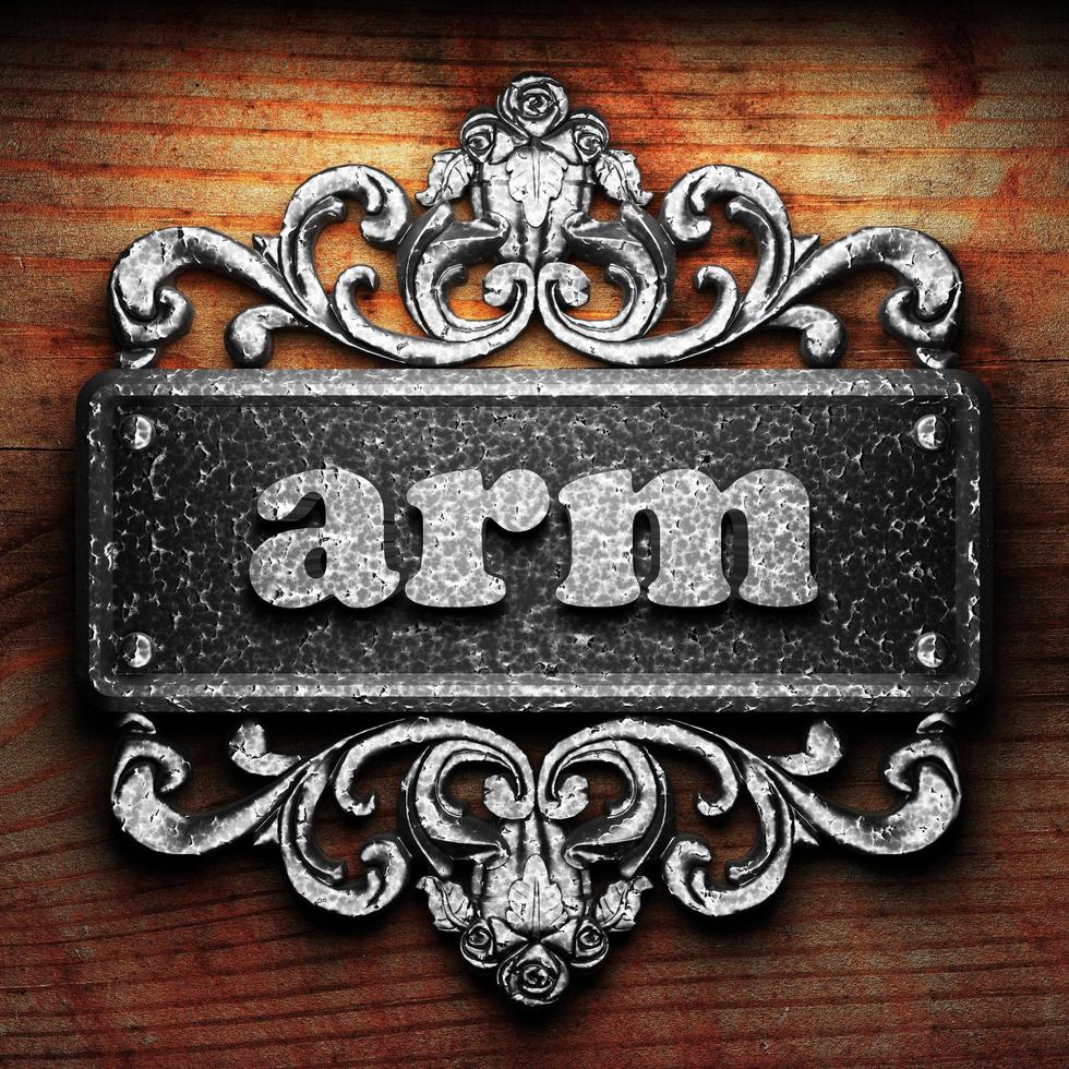 arm word of iron on wooden background photo
