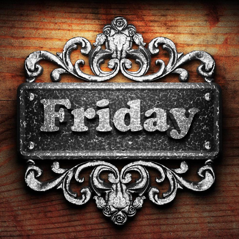 Friday word of iron on wooden background photo