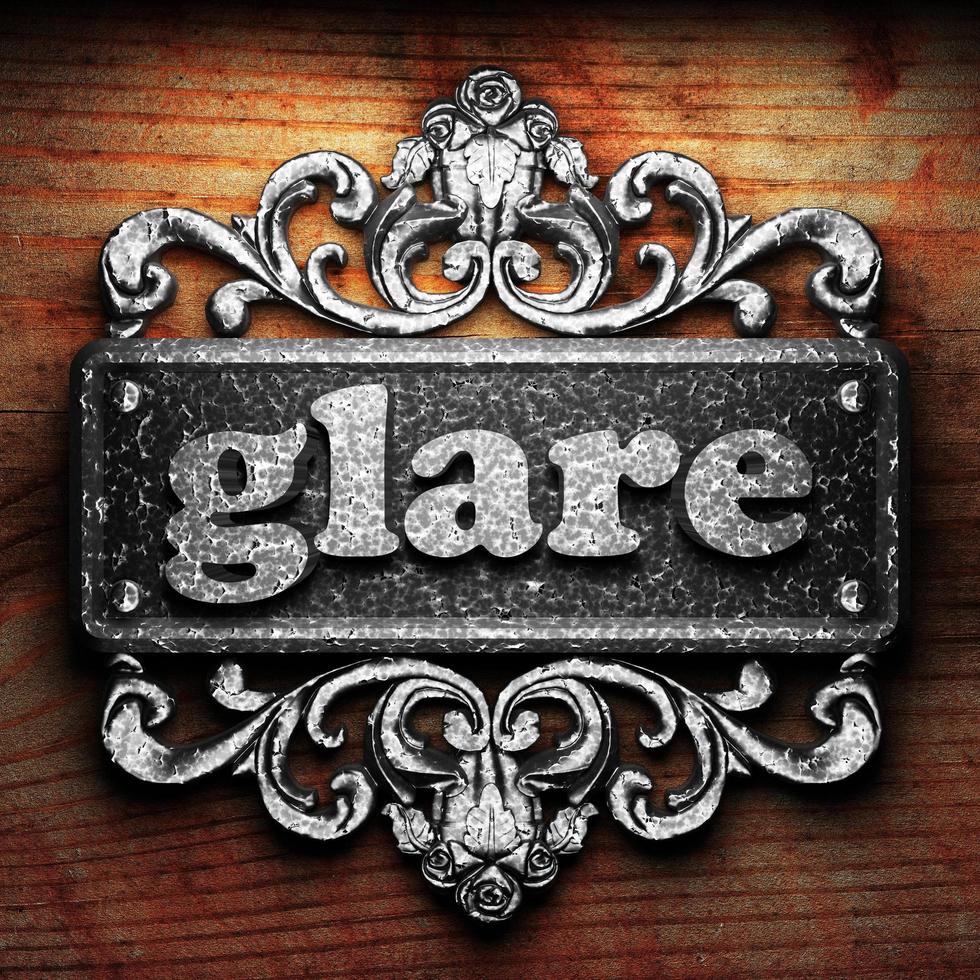 glare word of iron on wooden background photo