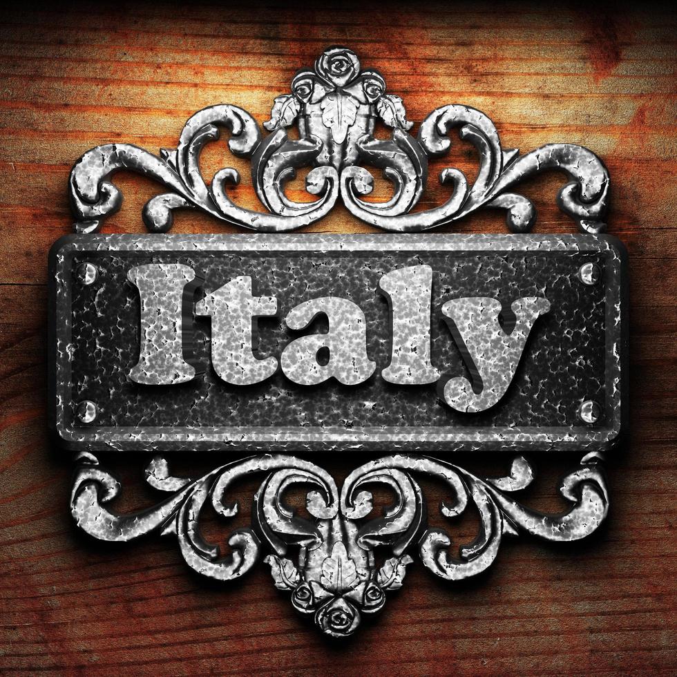 Italy word of iron on wooden background photo