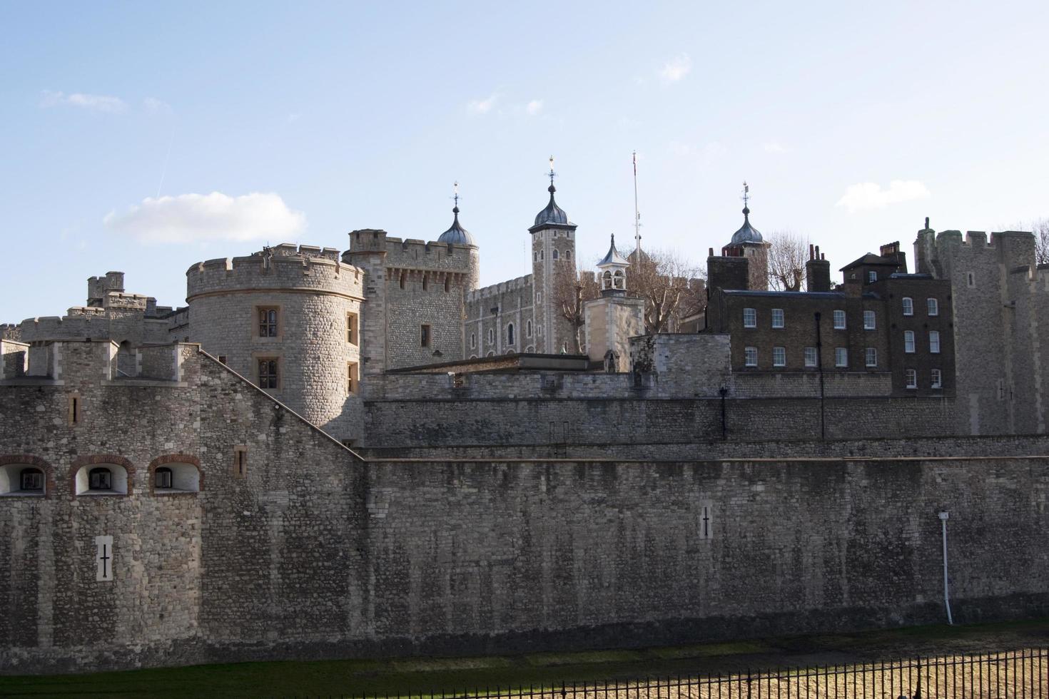 View of the Royal Palace and Fortress of the Tower of London, an historic castle on the north bank of the River Thames in central London. photo