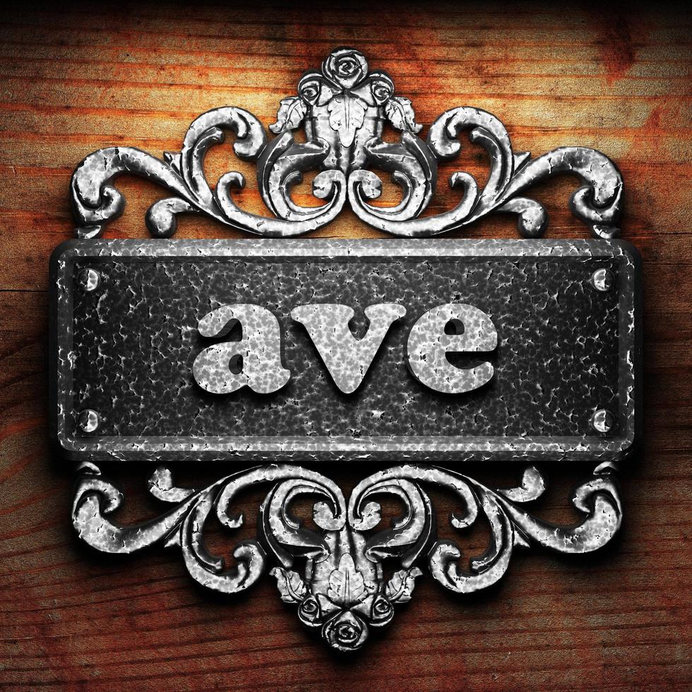 ave word of iron on wooden background photo