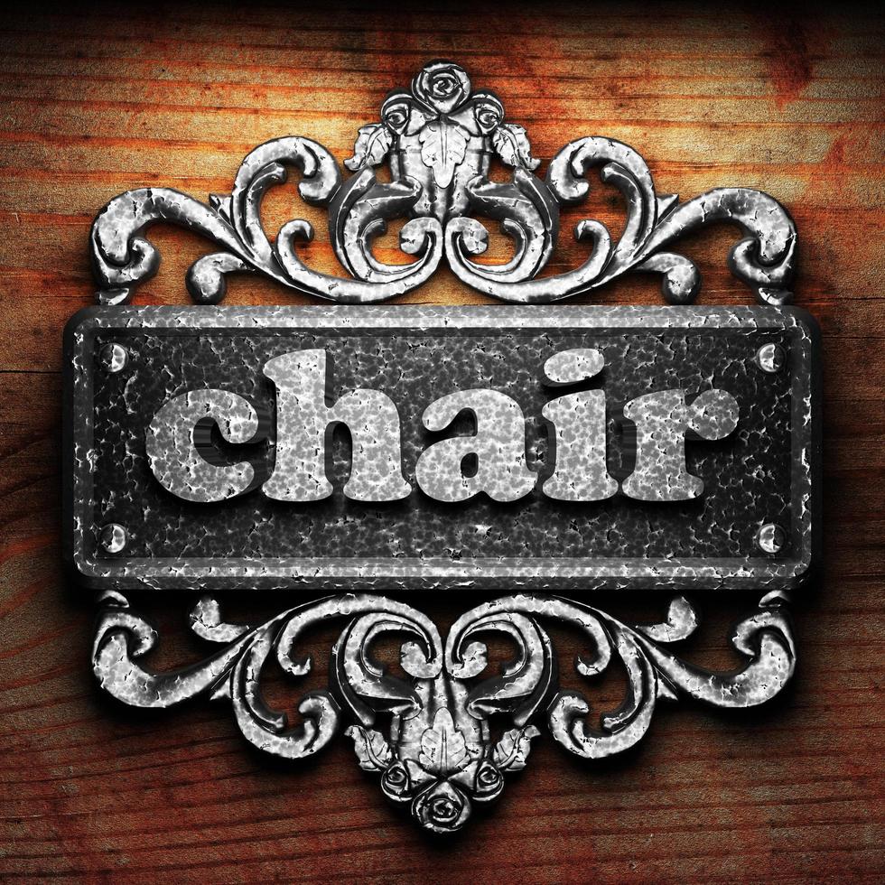 chair word of iron on wooden background photo