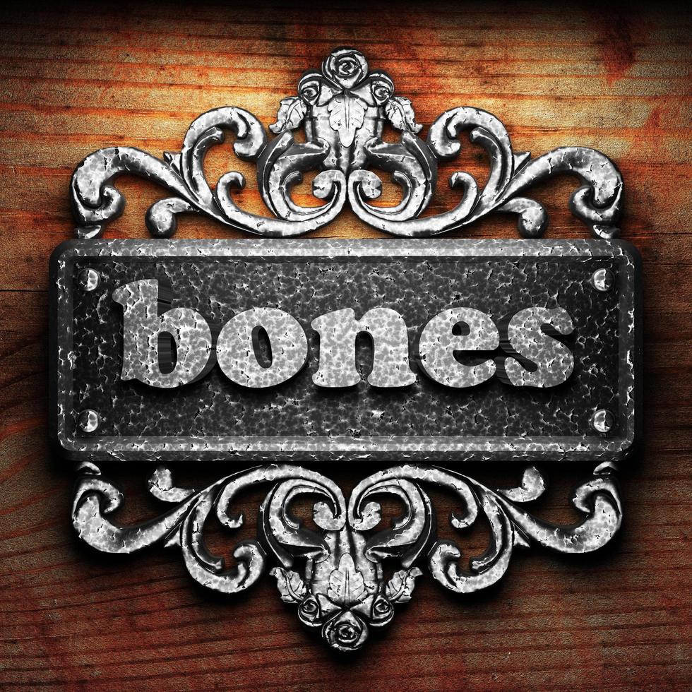 bones word of iron on wooden background photo