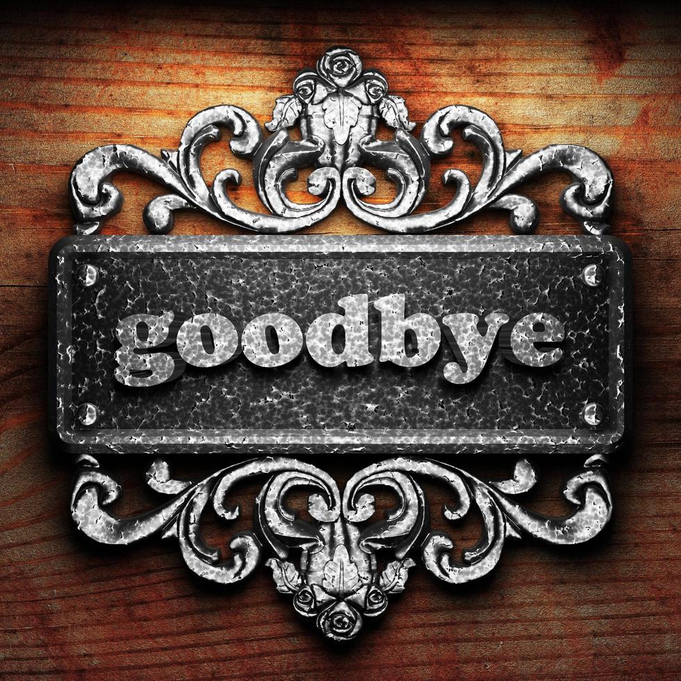 goodbye word of iron on wooden background photo
