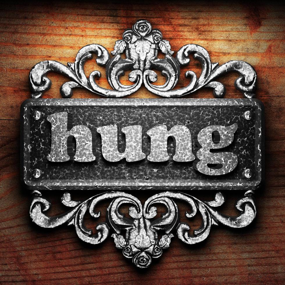 hung word of iron on wooden background photo