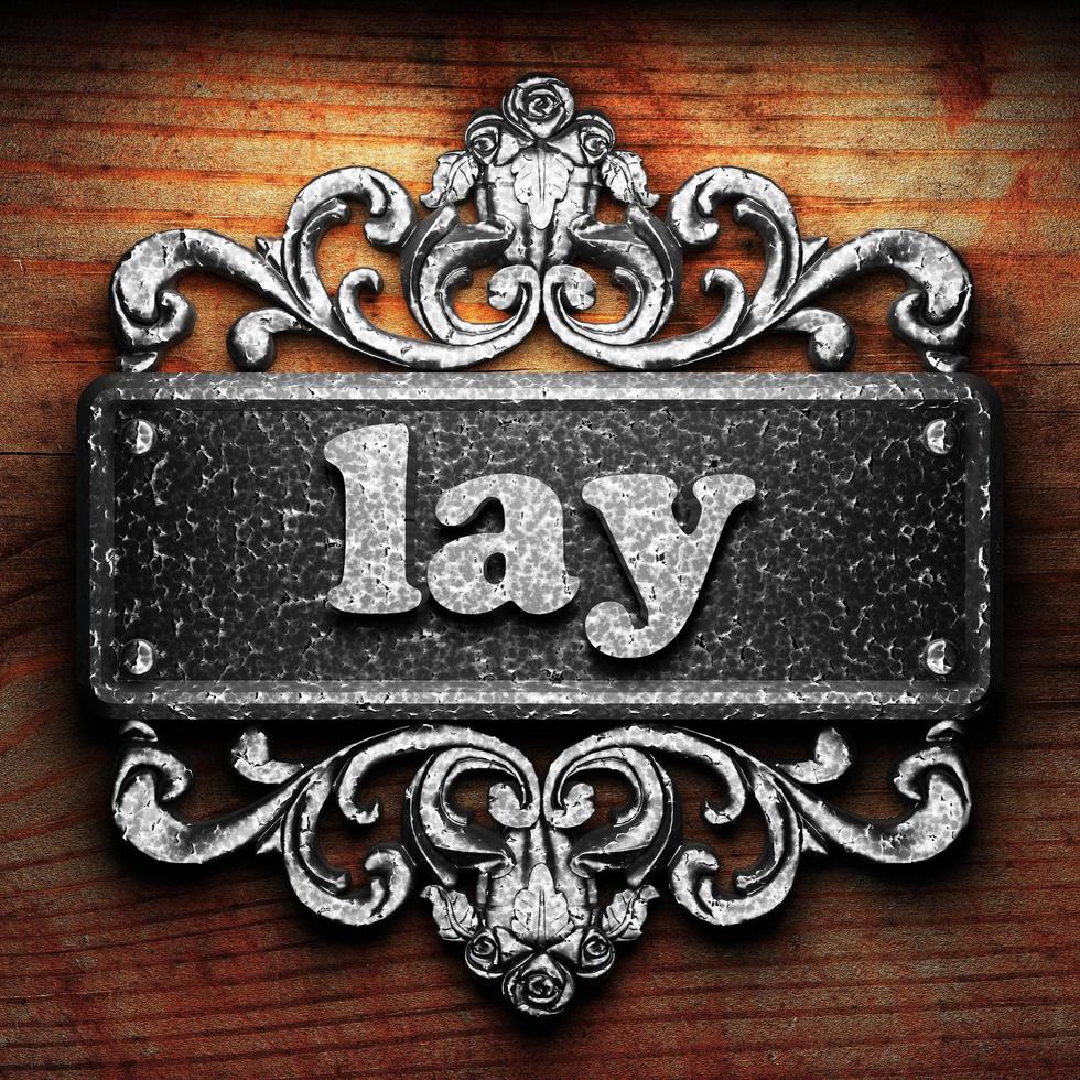 lay word of iron on wooden background photo