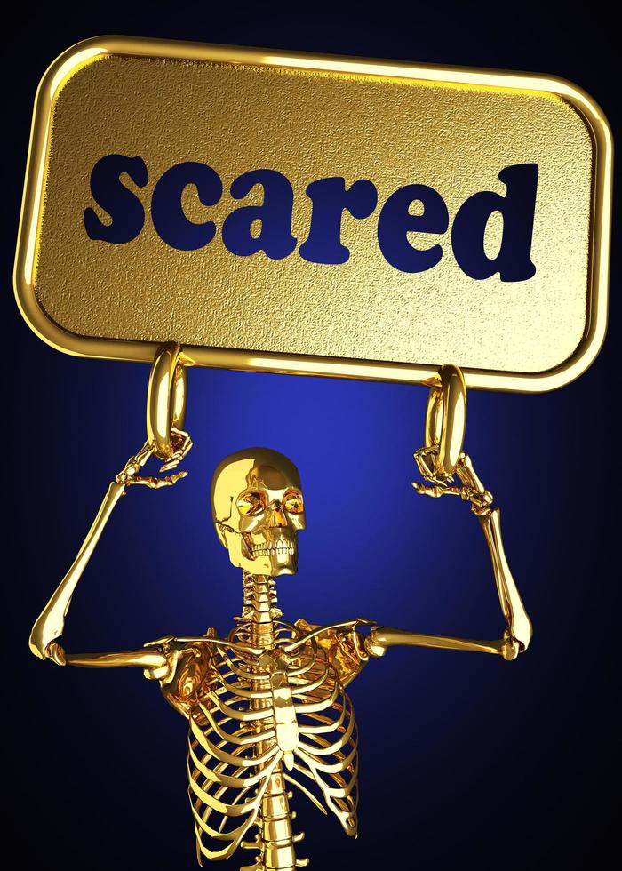 palabra asustada y esqueleto dorado foto