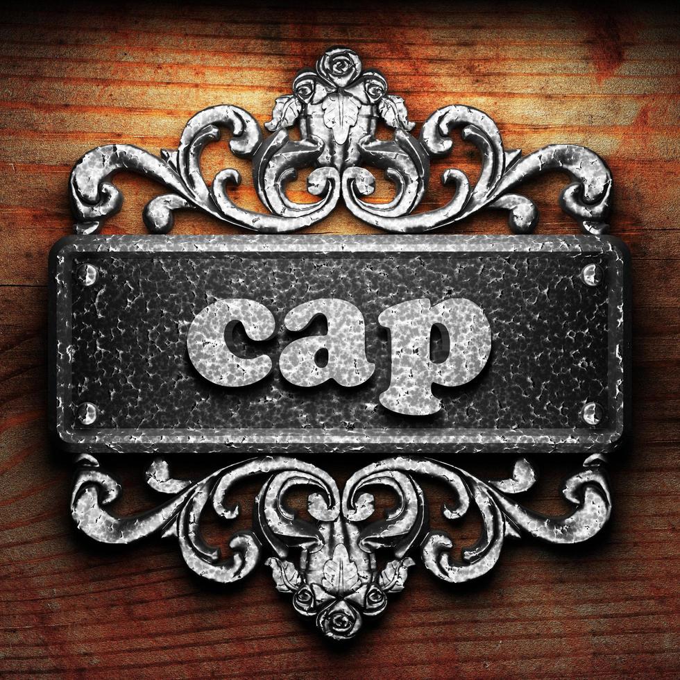 cap word of iron on wooden background photo