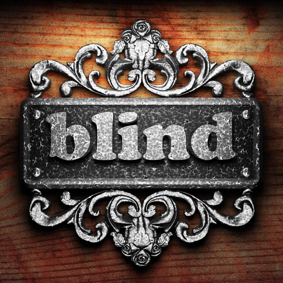 blind word of iron on wooden background photo