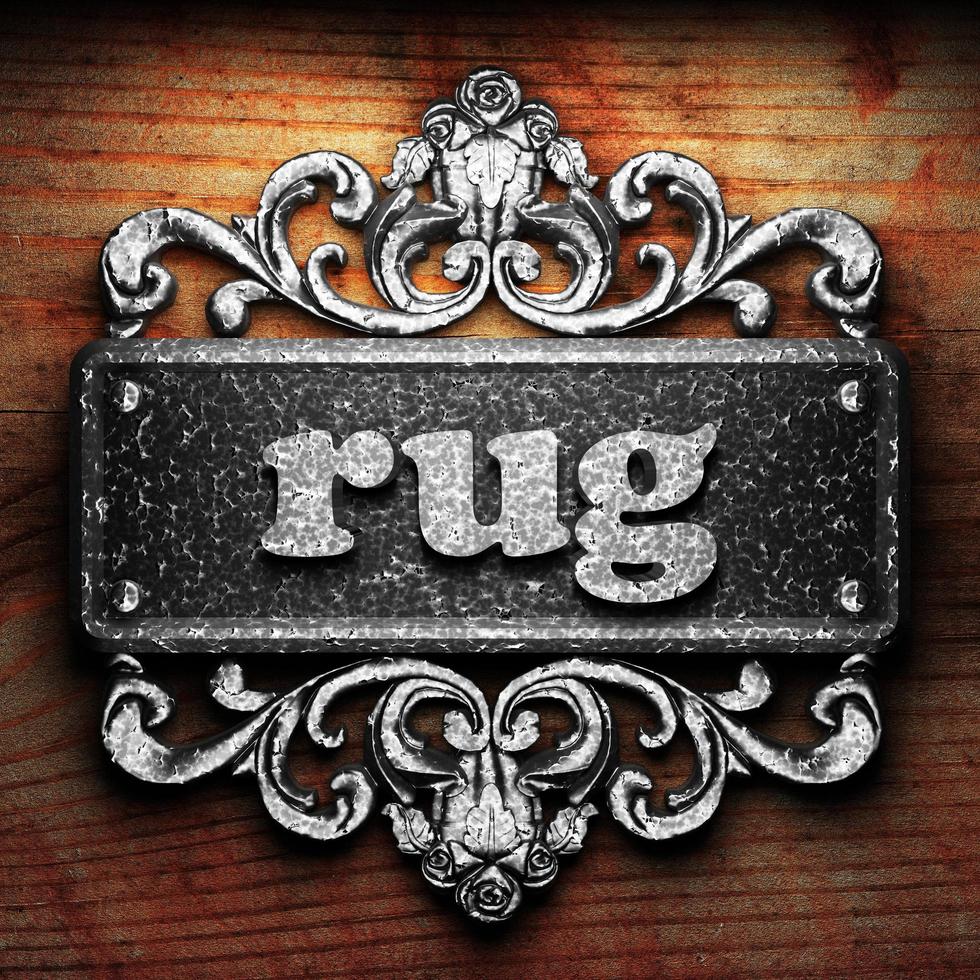 rug word of iron on wooden background photo