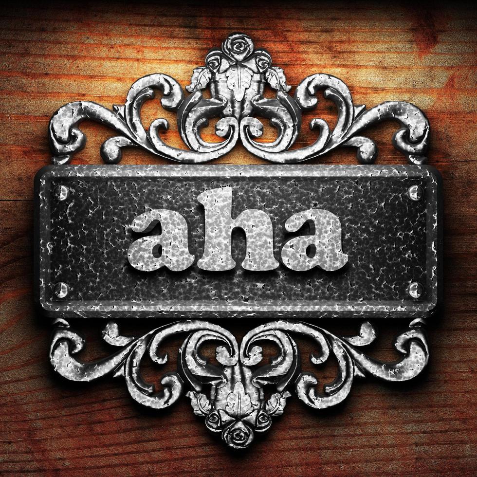 aha word of iron on wooden background photo