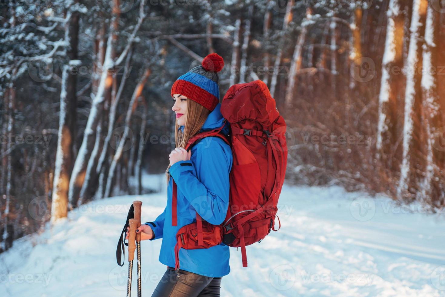 Woman Traveler with backpack hiking Travel Lifestyle adventure concept active vacations outdoor. Beautiful landscape  forest photo