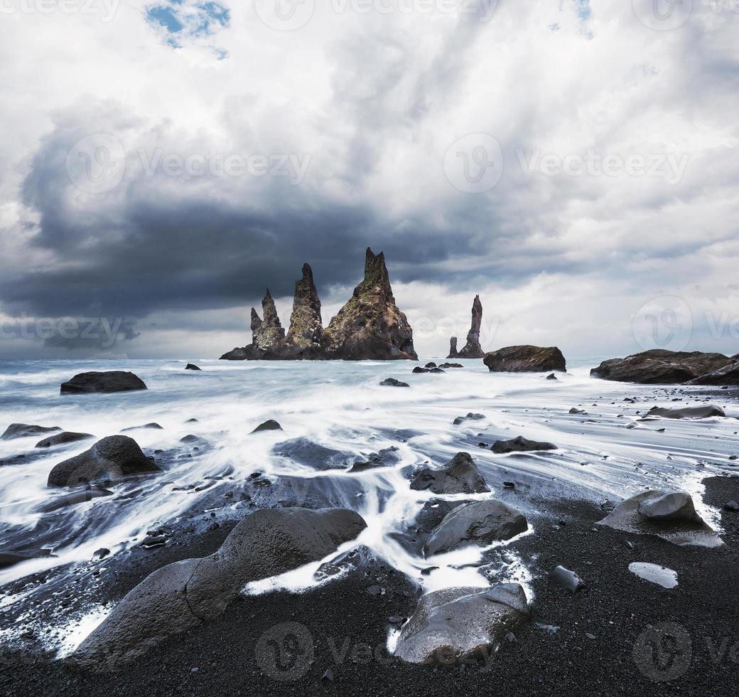 Iceland, Jokulsarlon lagoon, Beautiful cold landscape picture of icelandic glacier lagoon bay, The Rock Troll Toes. Reynisdrangar cliffs. photo