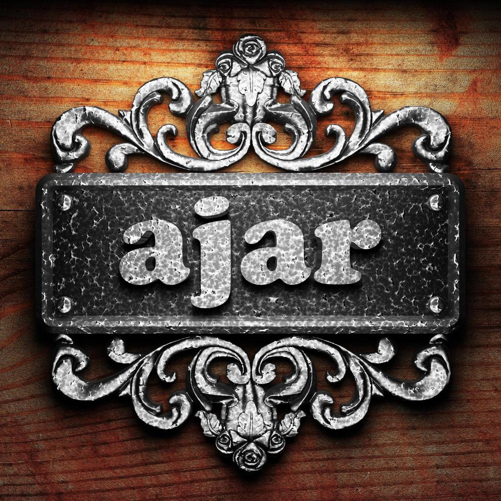 ajar word of iron on wooden background photo