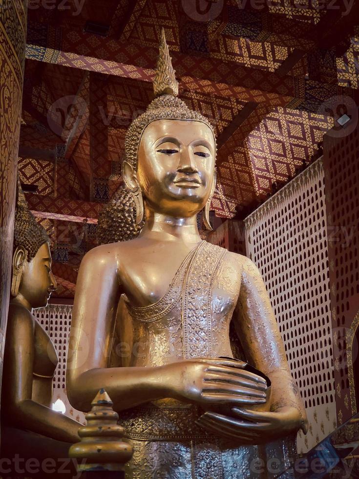 Ancient buddha statue in wat Thai or Thai temple. Giant Buddha god worship, Asian architecture art landmark, famous shrine for tourism. History spiritual temple of god. Travel Thailand attraction. photo