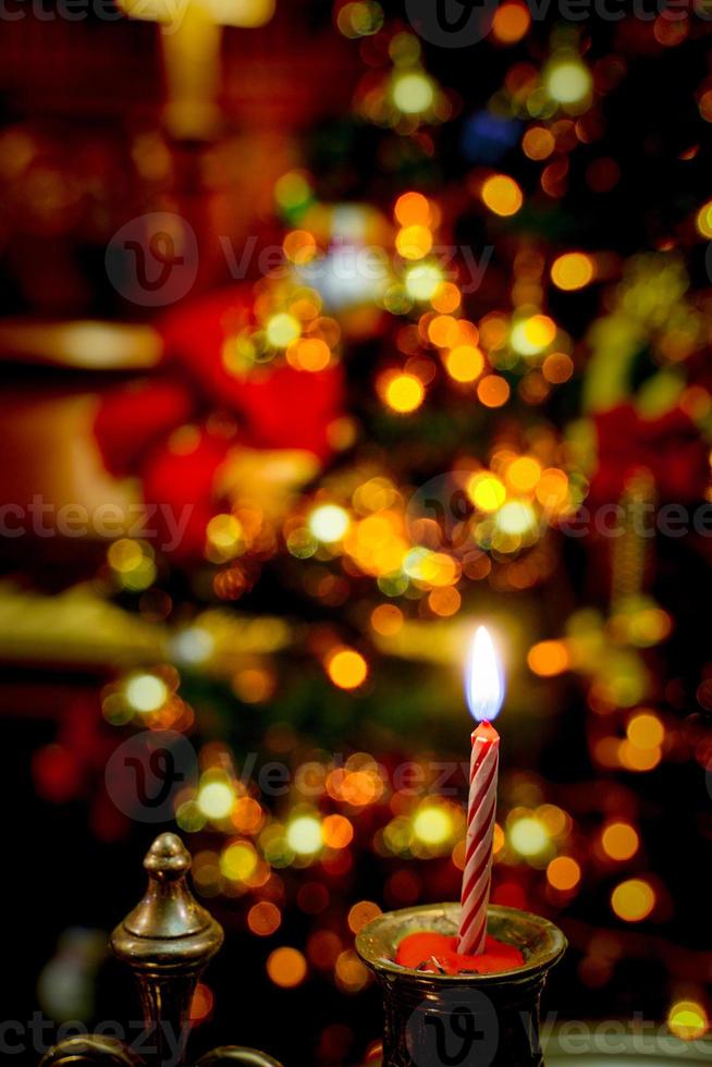 Christmas holiday with candle and tree decoration indoors. Season celebration home party in winter season. Indoor party event ornament happy festive time. No people. photo