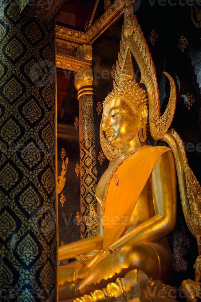 Ancient buddha statue in wat Thai or Thai temple. Giant Buddha god worship, Asian architecture art landmark, famous shrine for tourism. History spiritual temple of god. Travel Thailand attraction. photo