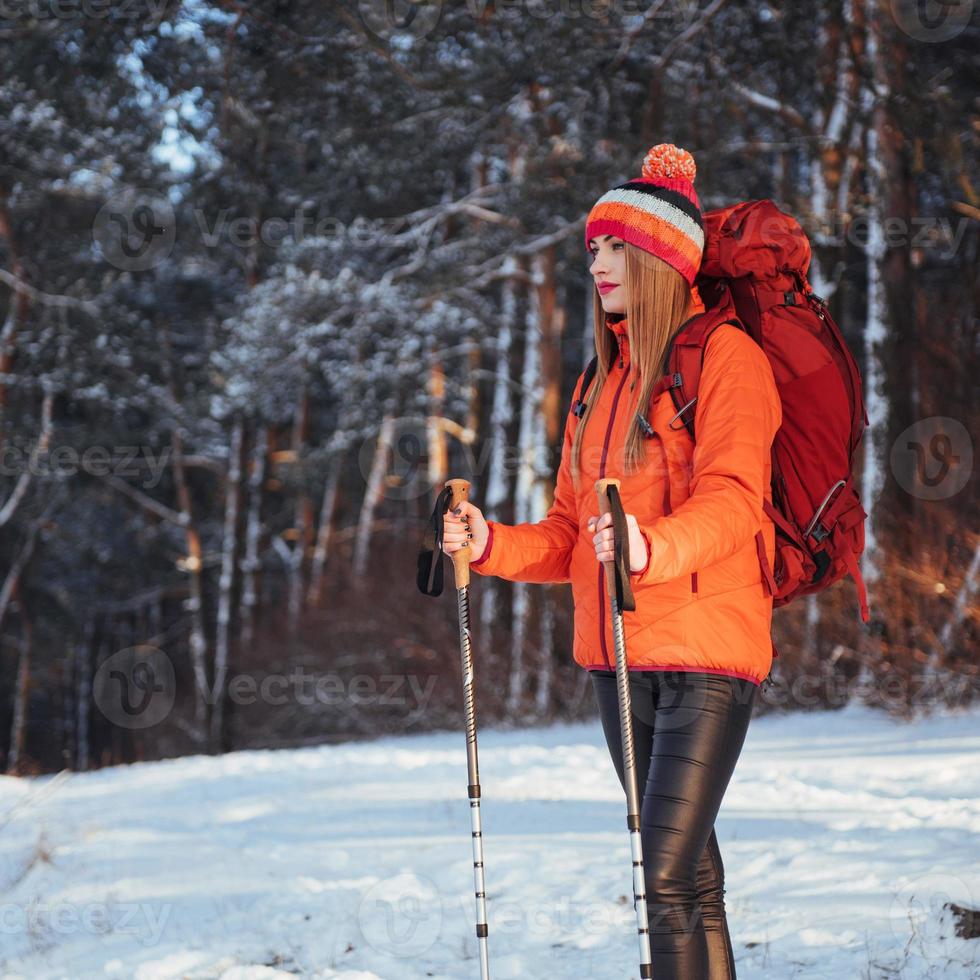 Woman Traveler with backpack hiking Travel Lifestyle adventure concept active vacations outdoor. Beautiful landscape  forest photo