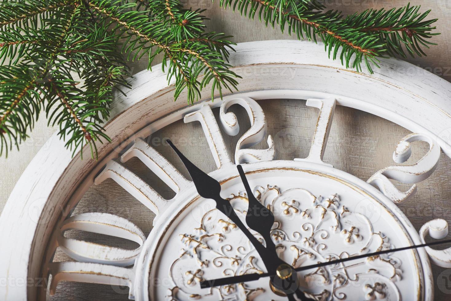 Happy New Year at midnight 2018, Old wooden clock and fir branches photo