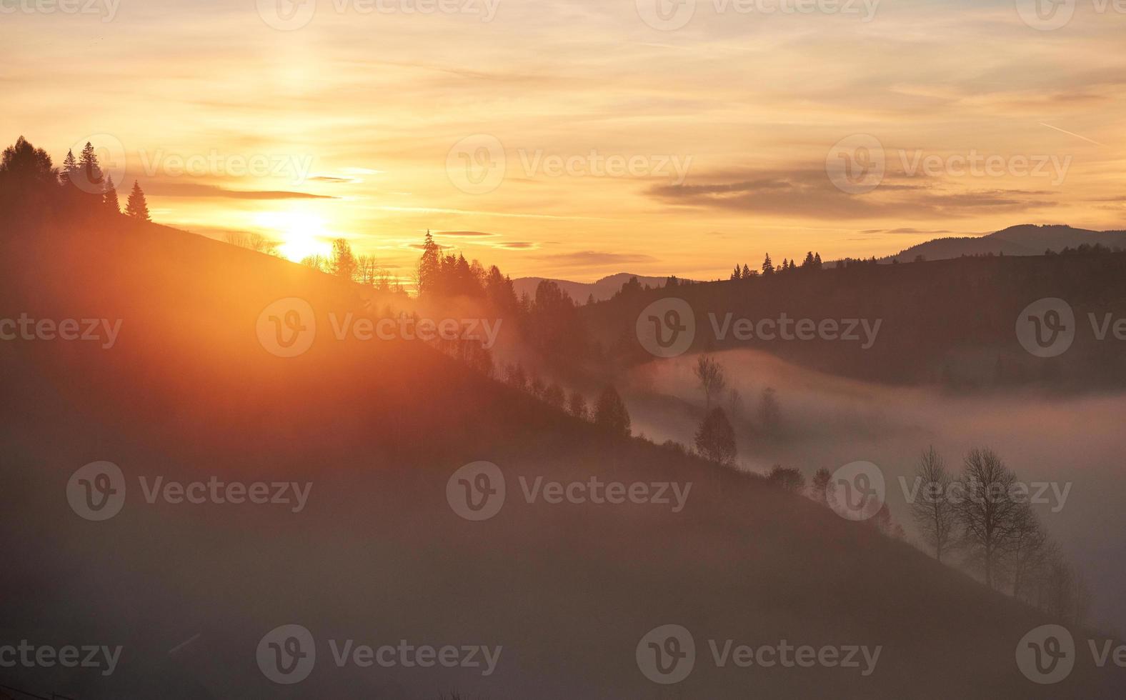 Foggy morning in the Ukrainian Carpathian Mountains in the autumn season photo