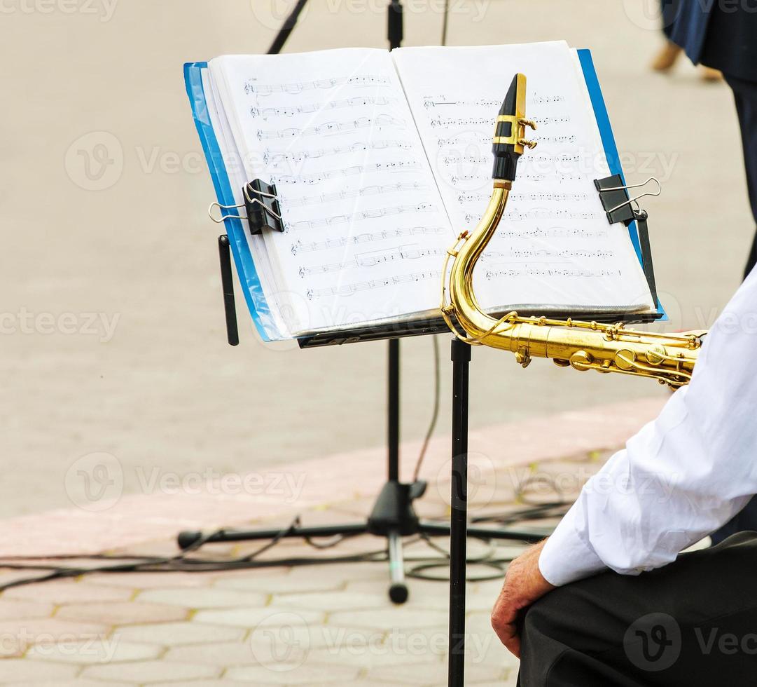 the musician plays the trumpet in the city orchestra photo