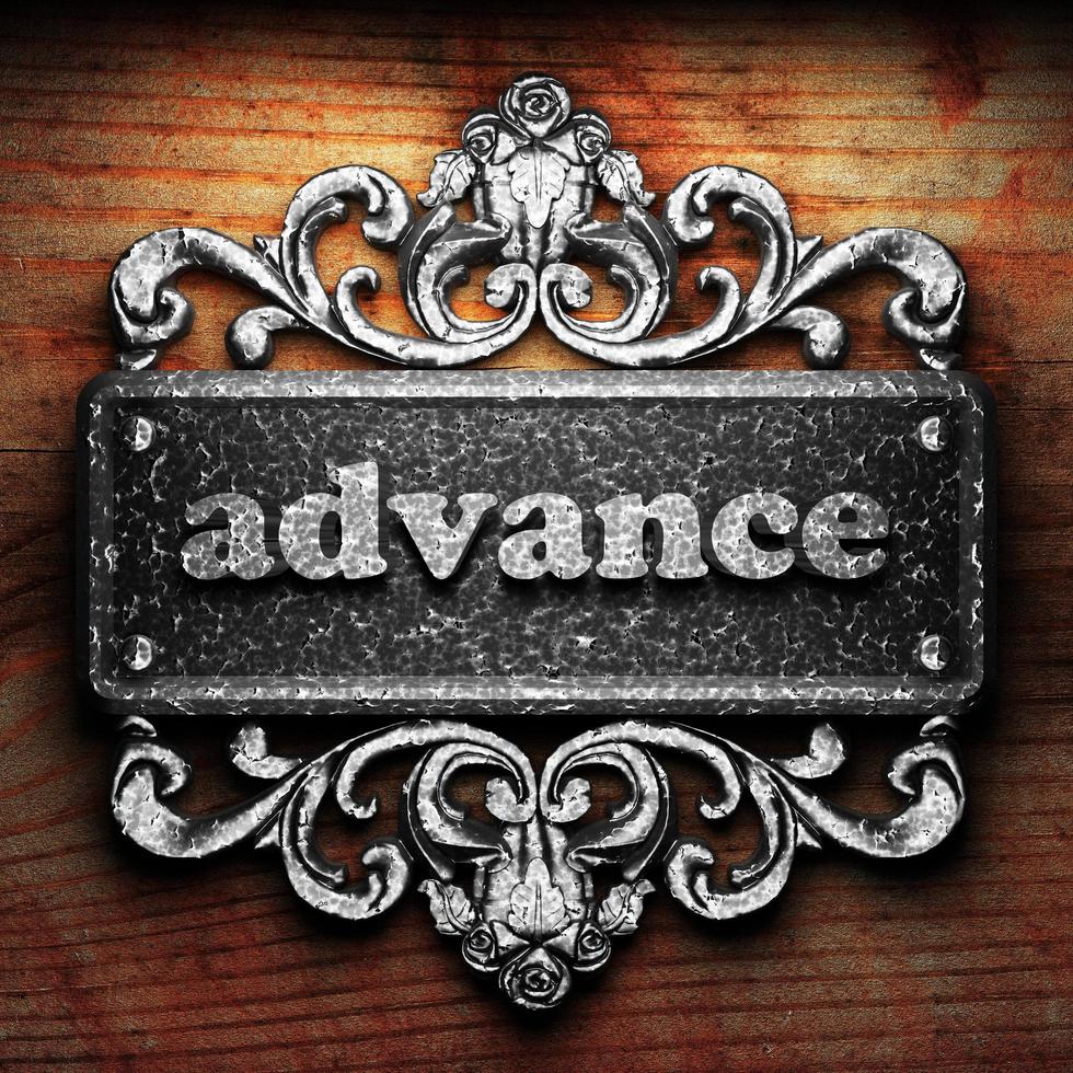 advance word of iron on wooden background photo