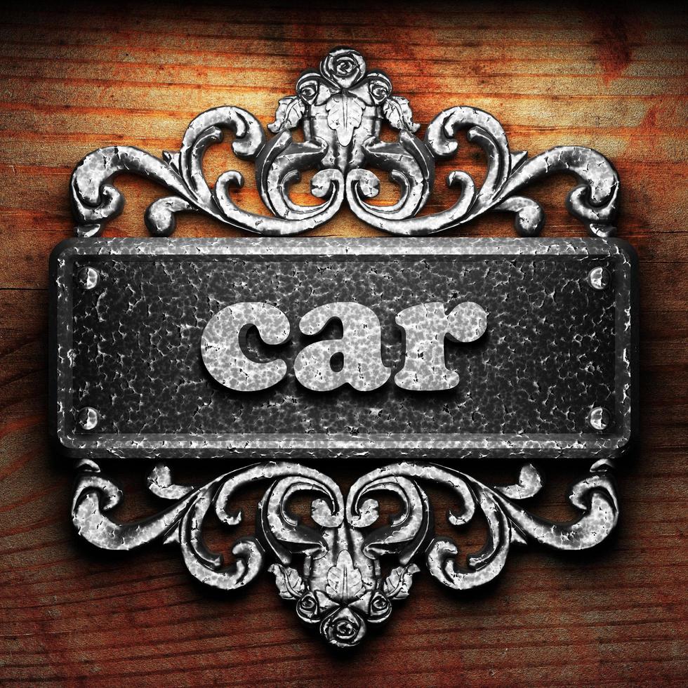 car word of iron on wooden background photo