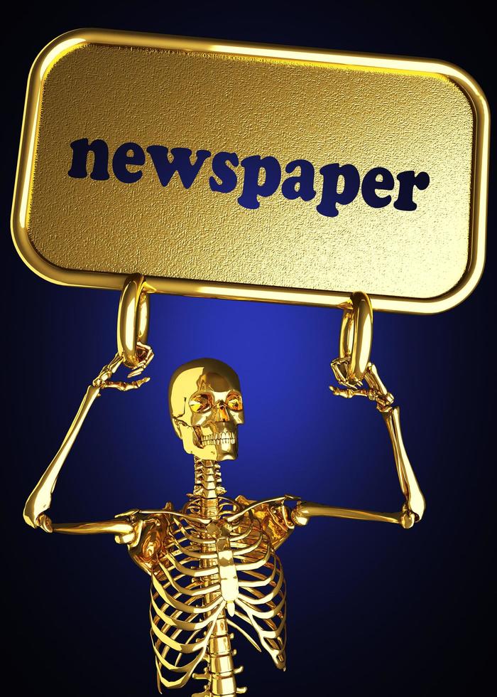 palabra de periódico y esqueleto dorado foto