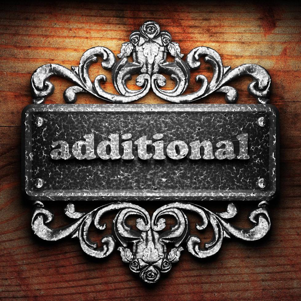 additional word of iron on wooden background photo