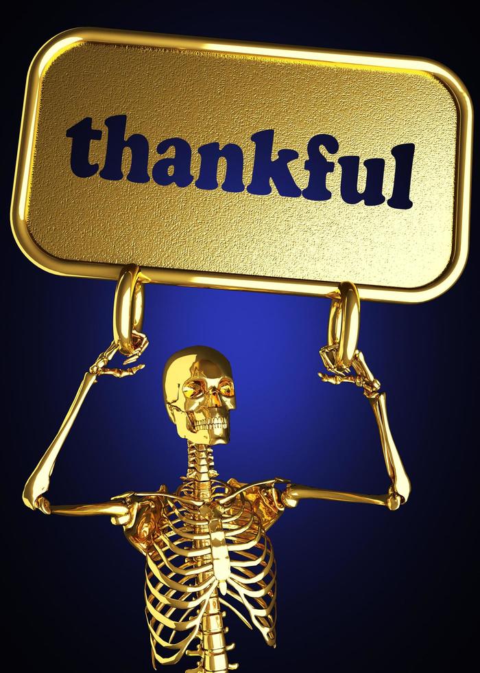 palabra agradecida y esqueleto dorado foto