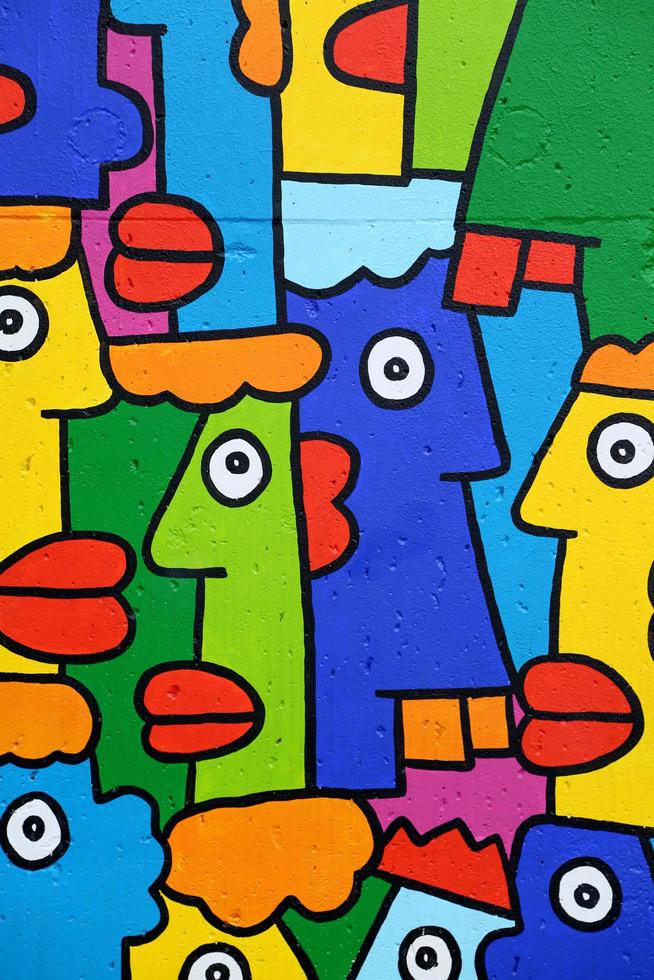 Berlin, Germany, July 12, 2013 - Detail of the Berlin Wall graffiti art. Berlin Wall was reconstructed in 1980's and made 14 feet tall and became popular for artists from all over the world photo