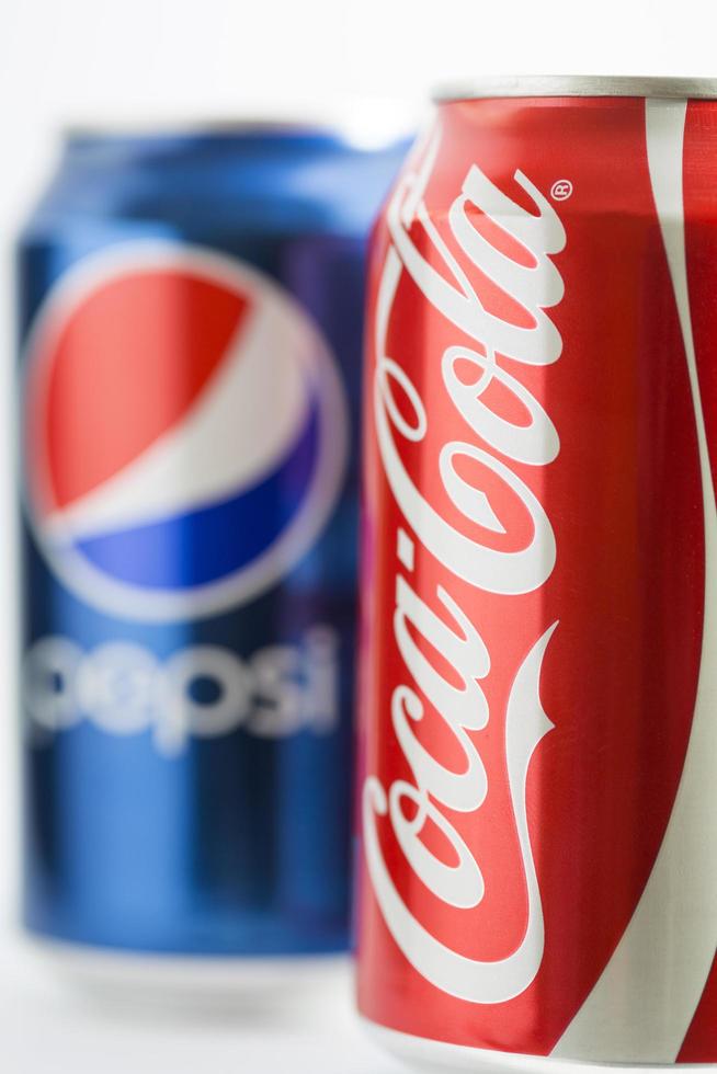 Belgrade, Serbia, October 15, 2014 - Cans of Pepsi and Coca-Cola. They are among the most popular carbonated drinks in the world. photo