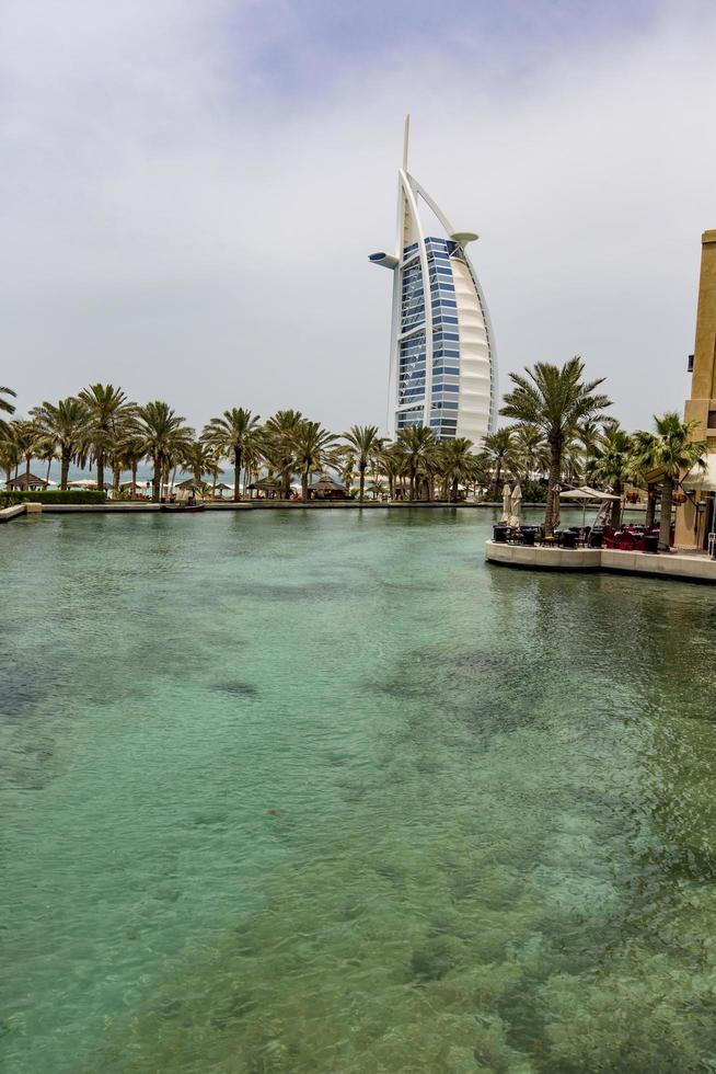 Dubai, UAE, May 8, 2015 - View at hotel Burj al Arab from Madinat Jumeirah in Dubai. Madinat Jumeirah encompasses two hotels and clusters of 29 traditional Arabic houses. photo