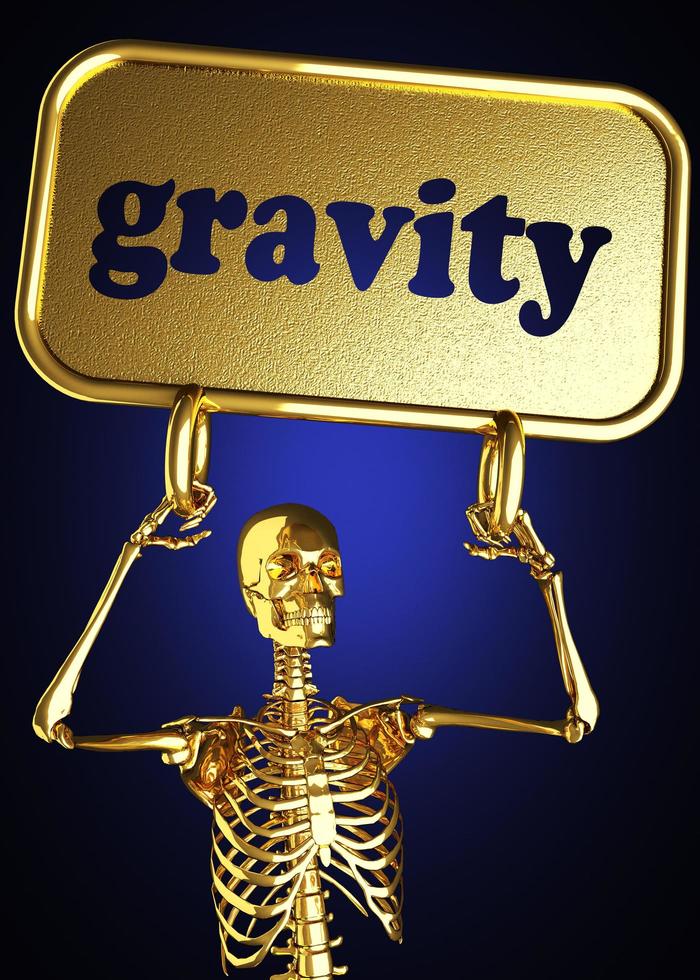 palabra de gravedad y esqueleto dorado foto