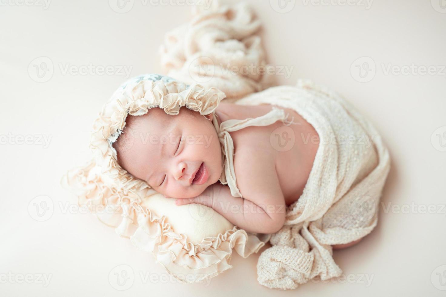 Happy newborn baby sleeping photo