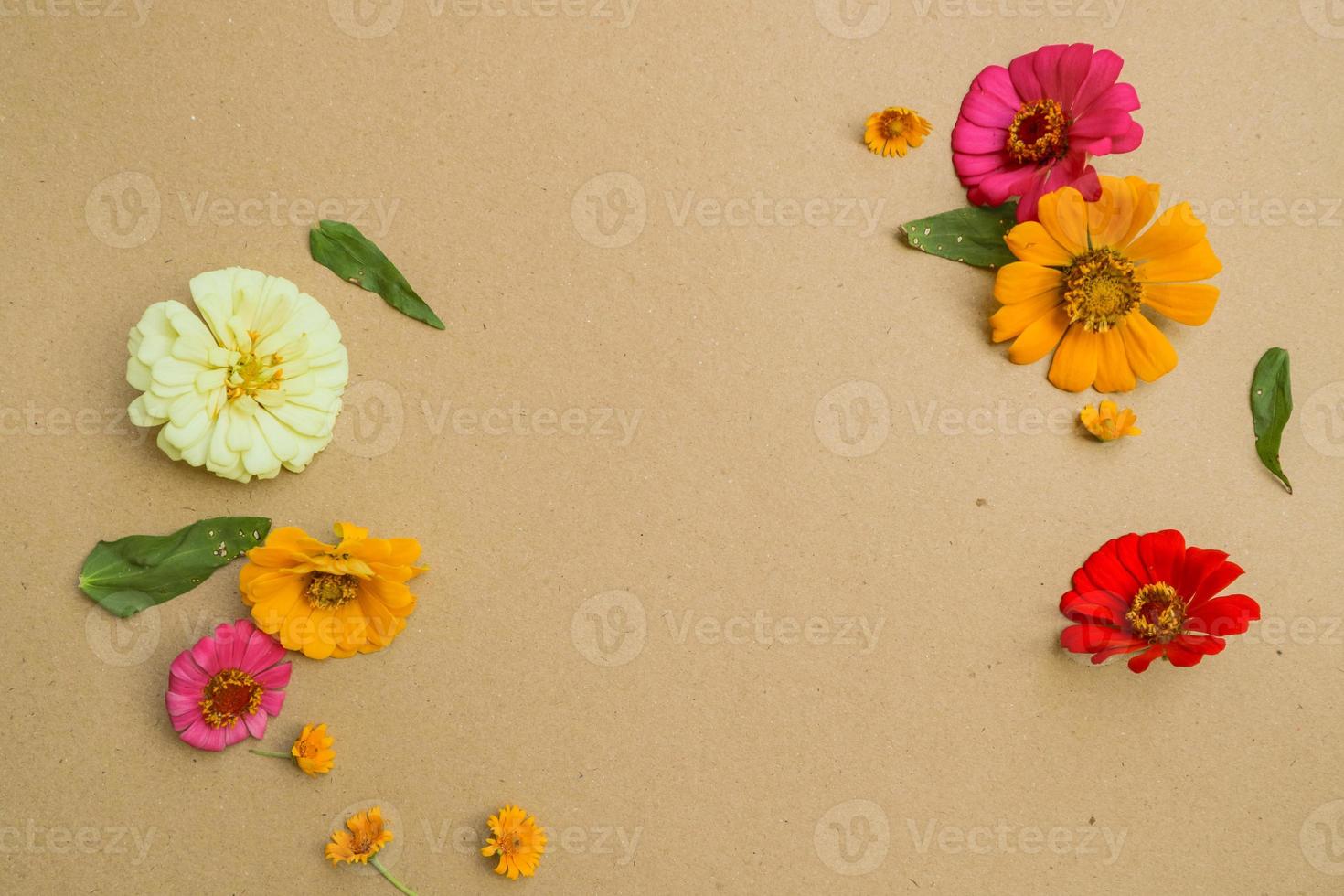 Beautiful flower flat lay arrangement on brown background. Flat lay bouquet, top view, overhead, empty space for copied text. photo