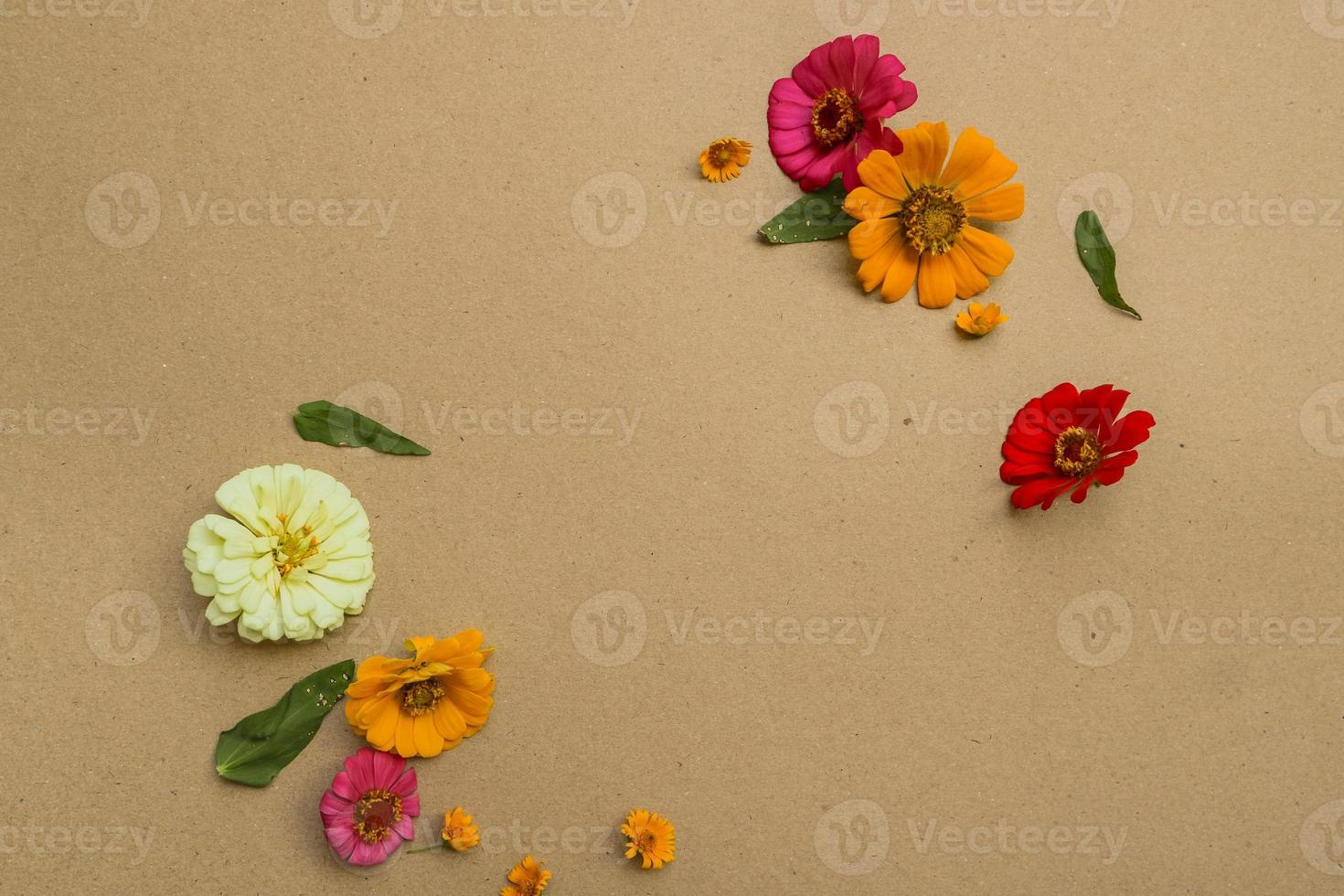 Beautiful flower flat lay arrangement on brown background. Flat lay bouquet, top view, overhead, empty space for copied text. photo