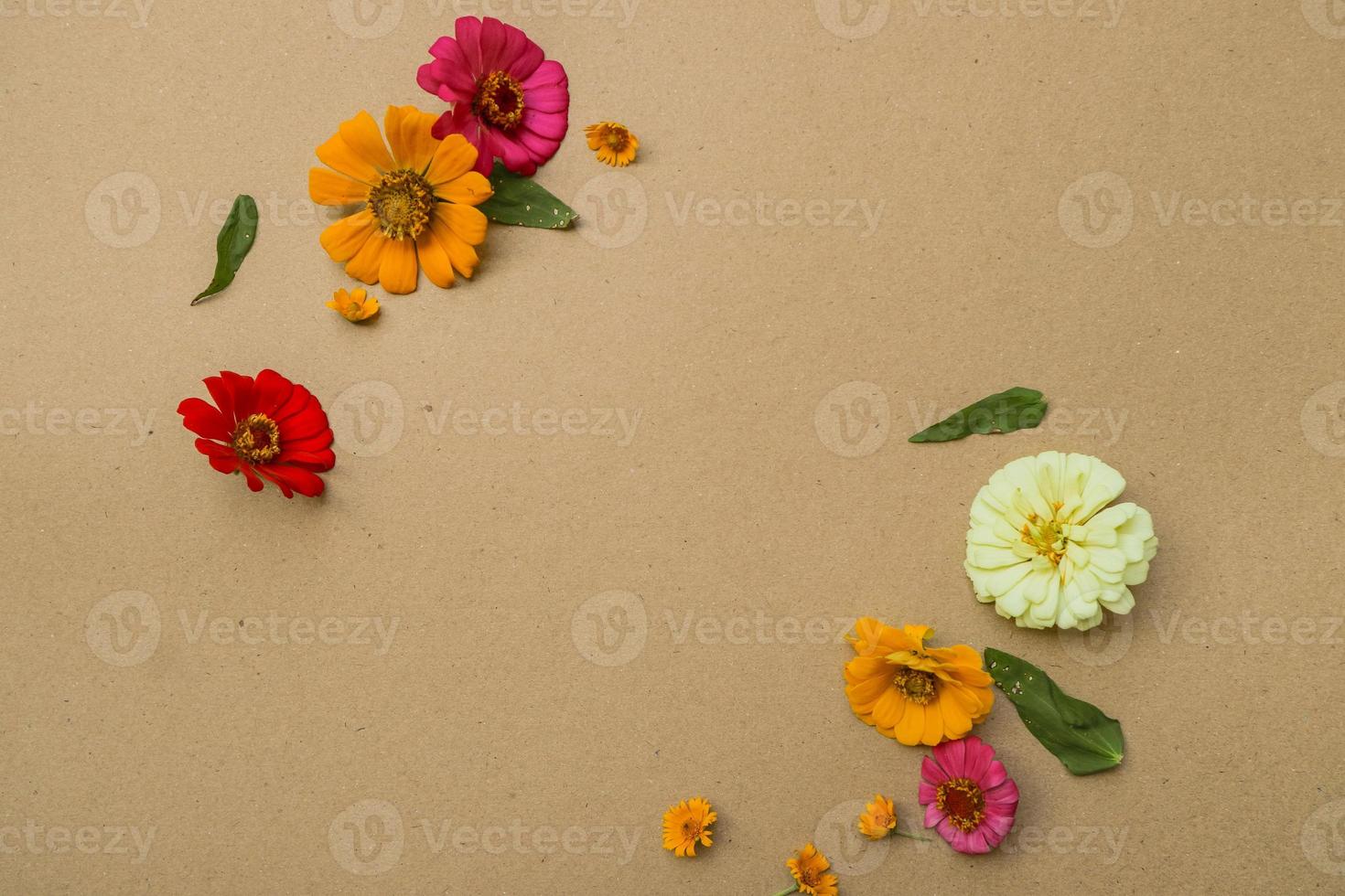 Beautiful flower flat lay arrangement on brown background. Flat lay bouquet, top view, overhead, empty space for copied text. photo