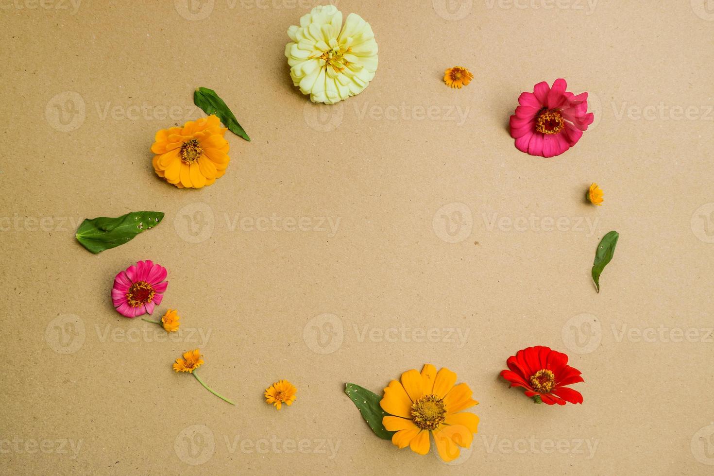 Beautiful flower flat lay arrangement on brown background. Flat lay bouquet, top view, overhead, empty space for copied text. photo