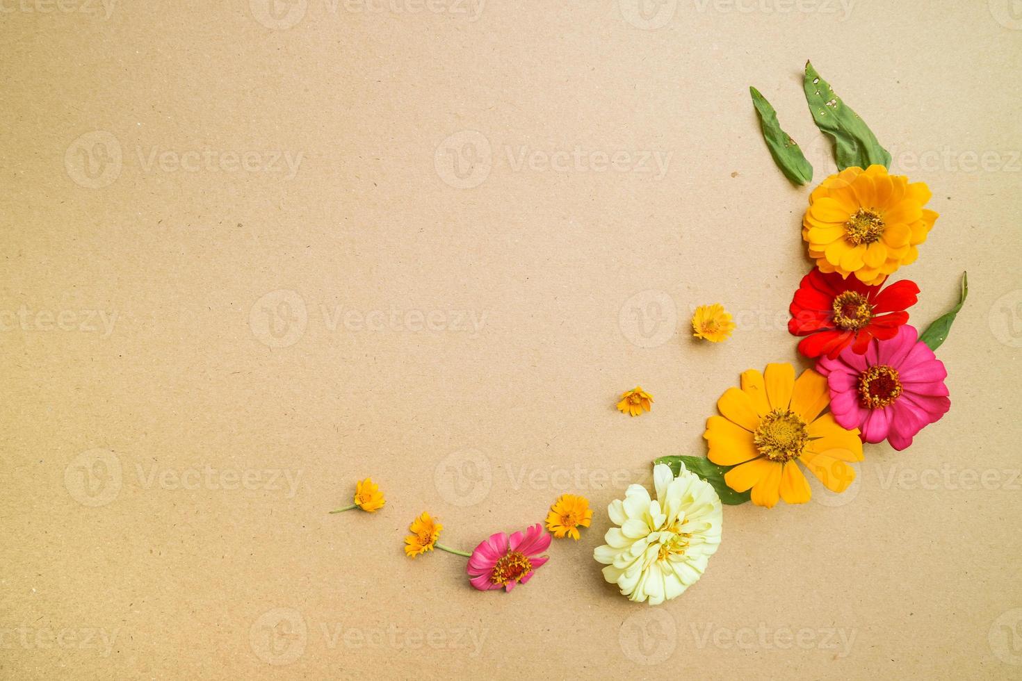 Beautiful flower flat lay arrangement on brown background. Flat lay bouquet, top view, overhead, empty space for copied text. photo